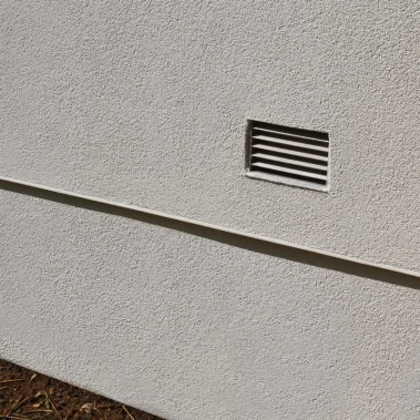 DRAIN SCREED ON FINISHED WALL